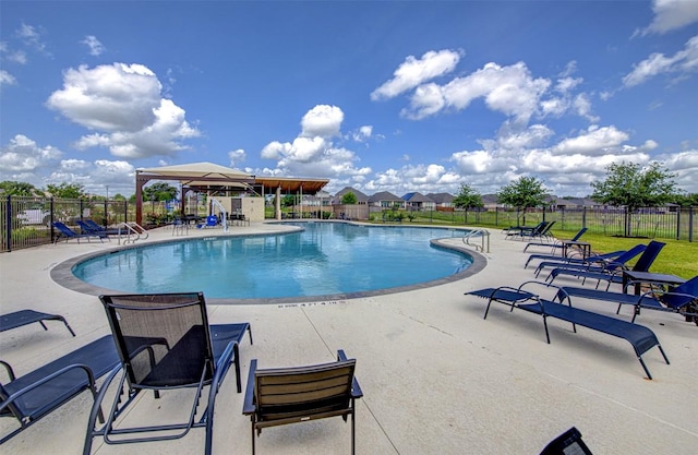 102 George Kimble Cv, Bastrop, TX 78602 - community pool with a patio area