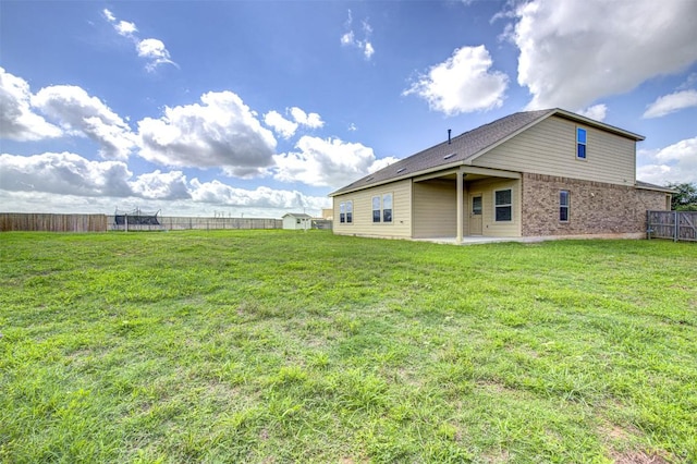 102 George Kimble Cv, Bastrop, TX 78602 - view of yard featuring a patio area