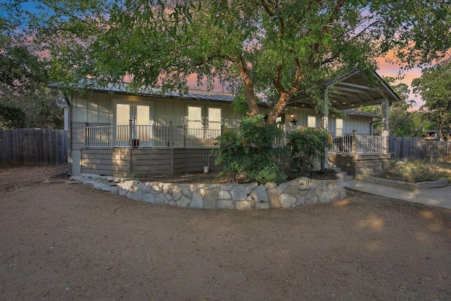 5604 Hudson Bend Rd, Austin, TX 78734 - view of front facade featuring french doors and board and batten siding