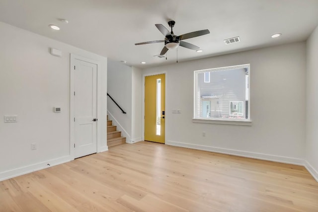 4127 E 12th St Unit 8, Austin, TX 78721 - foyer with stairway, light wood finished floors, baseboards, recessed lighting, and a ceiling fan