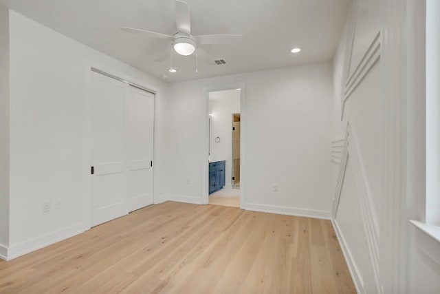 4127 E 12th St Unit 8, Austin, TX 78721 - unfurnished bedroom with light wood-type flooring, recessed lighting, baseboards, connected bathroom, and a closet