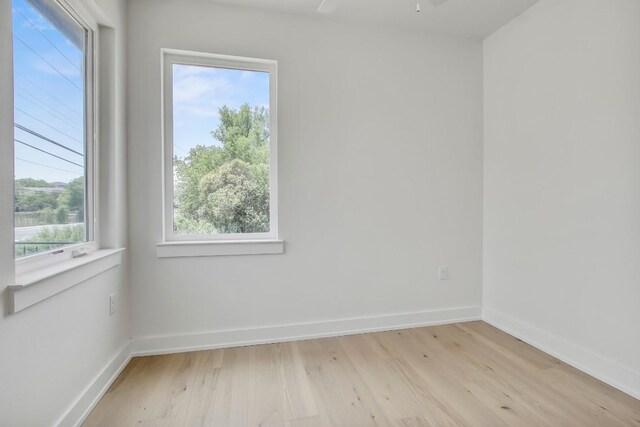 4127 E 12th St Unit 8, Austin, TX 78721 - spare room with light wood finished floors and baseboards