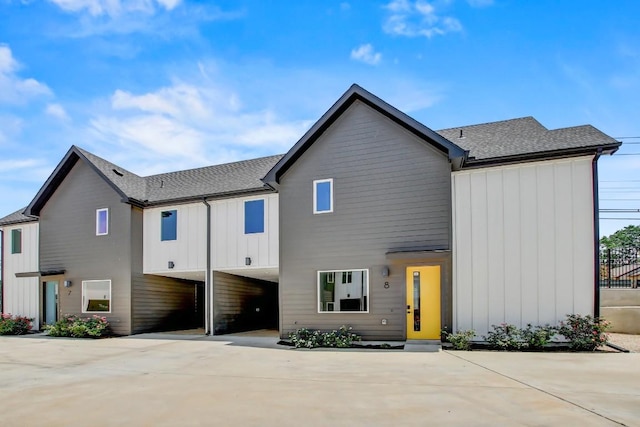 4127 E 12th St Unit 8, Austin, TX 78721 - view of front facade with board and batten siding and roof with shingles
