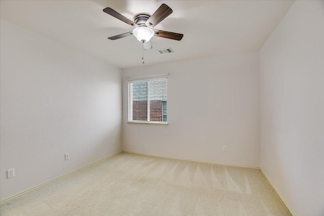 11120 Los Comancheros Rd, Austin, TX 78717 - spare room featuring light carpet, ceiling fan, and baseboards