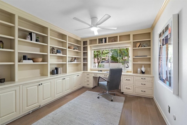 4607 Balcones Dr, Austin, TX 78731 - office area featuring built in study area, ceiling fan, wood finished floors, and ornamental molding