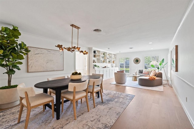 4607 Balcones Dr, Austin, TX 78731 - dining area with wood finished floors and recessed lighting