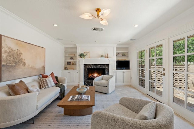 4607 Balcones Dr, Austin, TX 78731 - living area featuring built in features, crown molding, a premium fireplace, and recessed lighting