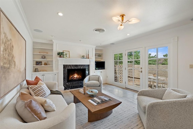 4607 Balcones Dr, Austin, TX 78731 - living room with a high end fireplace, crown molding, built in features, and recessed lighting