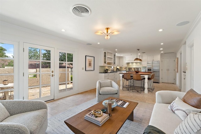 4607 Balcones Dr, Austin, TX 78731 - living area with recessed lighting, french doors, ornamental molding, and light tile patterned flooring