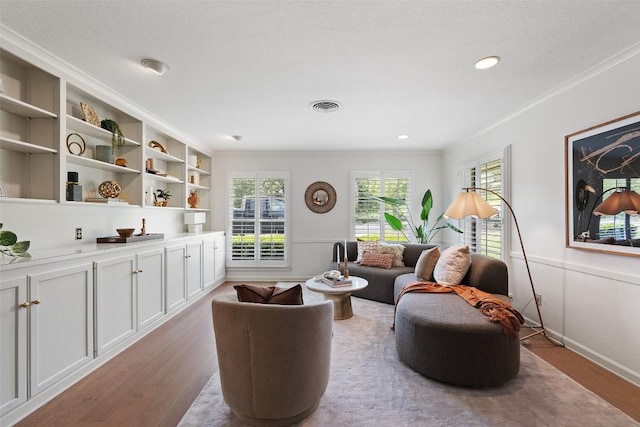 4607 Balcones Dr, Austin, TX 78731 - living area with light wood-style flooring and ornamental molding