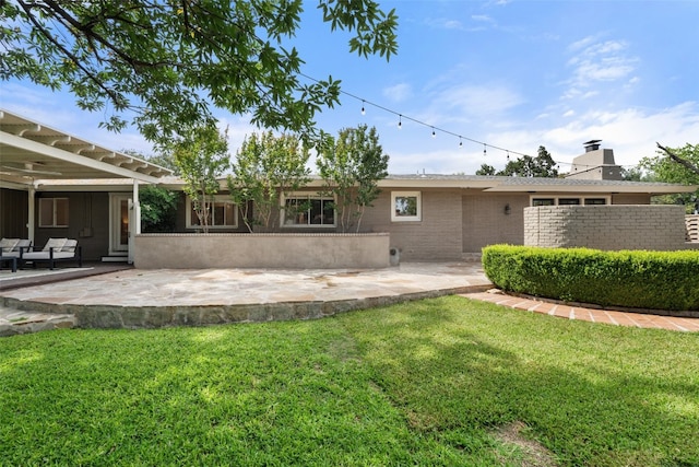 4607 Balcones Dr, Austin, TX 78731 - back of property featuring a yard, a patio area, brick siding, and a chimney