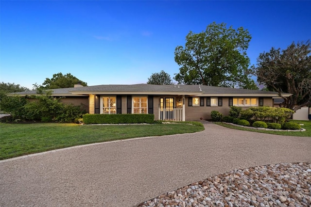 4607 Balcones Dr, Austin, TX 78731 - single story home with a front lawn and a chimney