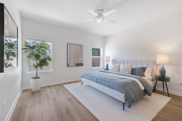 129 Syrah Ct, Leander, TX 78641 - bedroom with light wood-style flooring, baseboards, and a ceiling fan