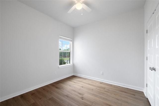 129 Syrah Ct, Leander, TX 78641 - unfurnished bedroom with wood finished floors, baseboards, and a ceiling fan