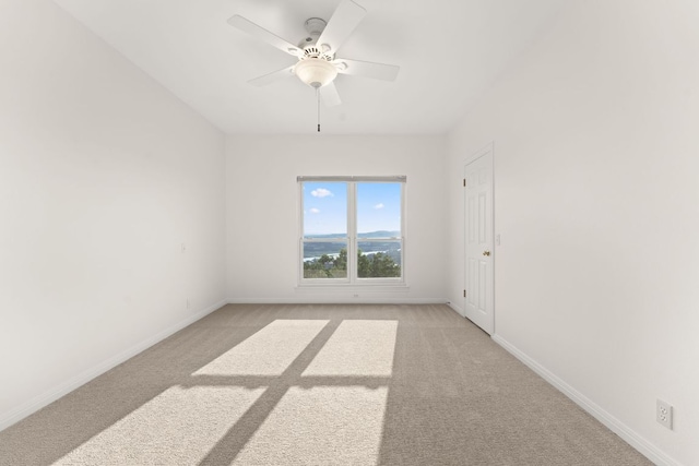 5913 N W Pl, Austin, TX 78731 - unfurnished room with light carpet, a ceiling fan, and baseboards