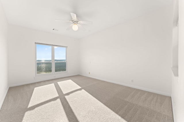 5913 N W Pl, Austin, TX 78731 - unfurnished room with light colored carpet, a ceiling fan, and baseboards