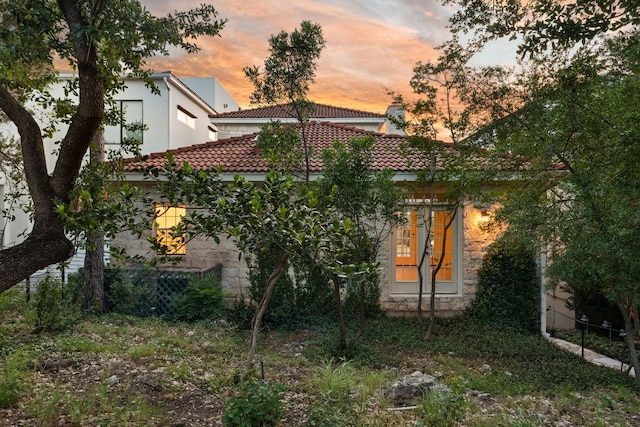 5913 N W Pl, Austin, TX 78731 - back of property with a tile roof and stone siding