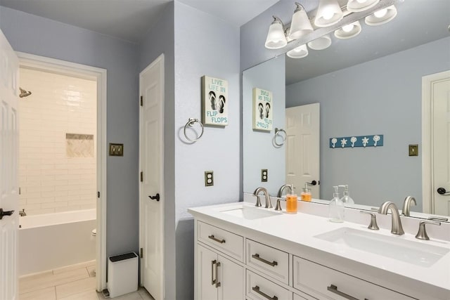 10672 Bramblecrest Dr, Austin, TX 78726 - full bath featuring double vanity, tile patterned flooring, shower / washtub combination, and baseboards