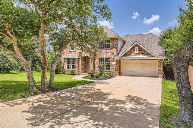 10672 Bramblecrest Dr, Austin, TX 78726 - traditional home featuring brick siding, concrete driveway, an attached garage, and a shingled roof