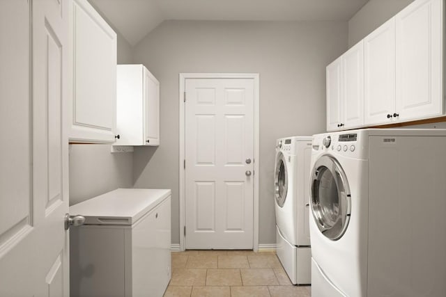 495 Catalina Ln, Austin, TX 78737 - washroom featuring cabinet space, separate washer and dryer, light tile patterned flooring, and baseboards