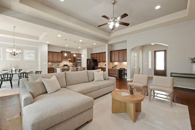 495 Catalina Ln, Austin, TX 78737 - living area with a raised ceiling, light wood-style flooring, arched walkways, ceiling fan, and recessed lighting