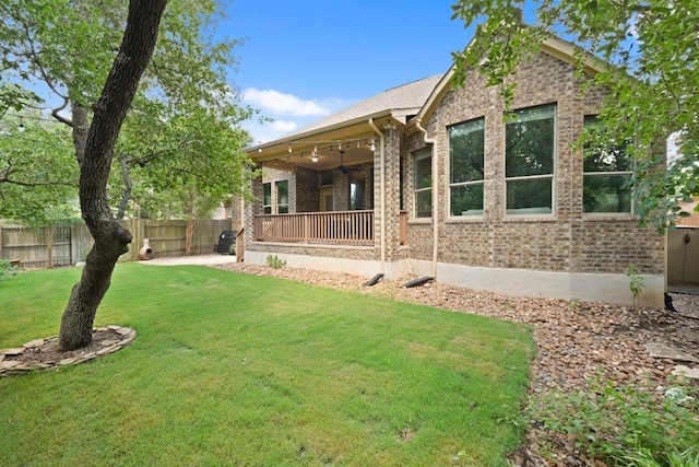 495 Catalina Ln, Austin, TX 78737 - rear view of property featuring brick siding