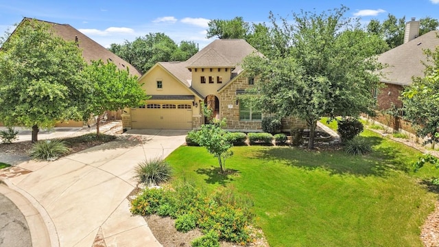 495 Catalina Ln, Austin, TX 78737 - view of front of property with stucco siding, an attached garage, driveway, a front yard, and stone siding
