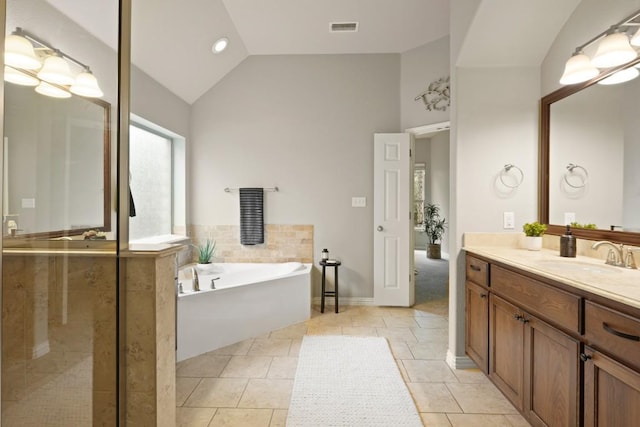 495 Catalina Ln, Austin, TX 78737 - bathroom featuring a bath, vanity, a shower stall, and high vaulted ceiling