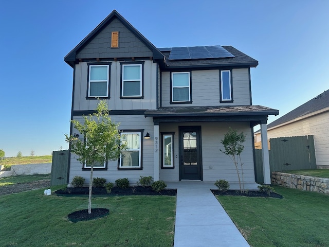 9312 Gladsome Path, Manor, TX 78653 - view of front of home featuring solar panels, covered porch, a shingled roof, and board and batten siding