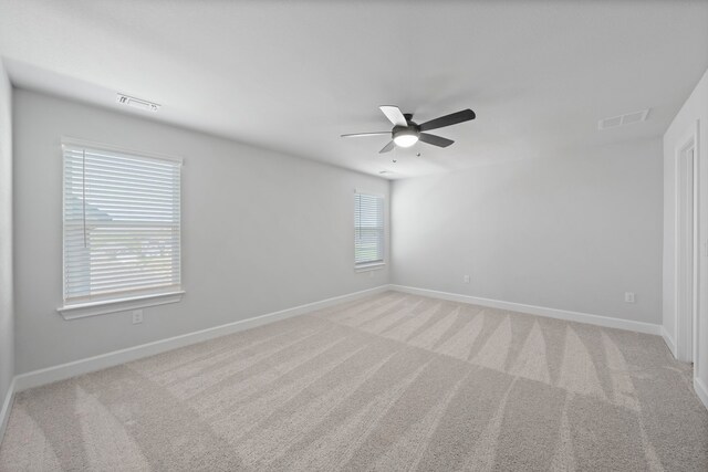 9513 Balmy Ln, Manor, TX 78653 - unfurnished room with ceiling fan, baseboards, and light carpet