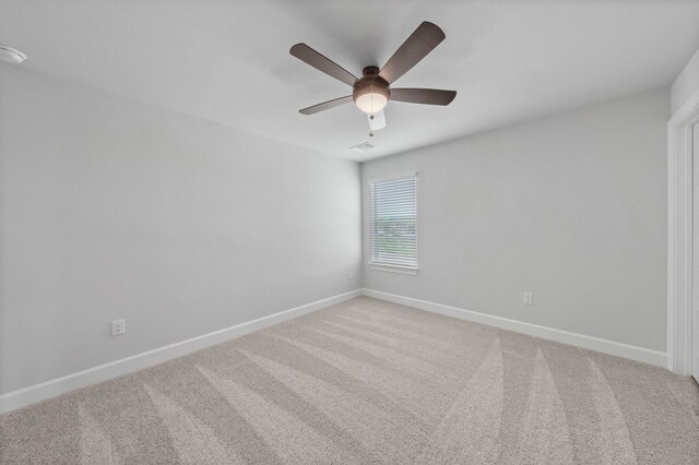 9513 Balmy Ln, Manor, TX 78653 - spare room with baseboards, a ceiling fan, and carpet flooring