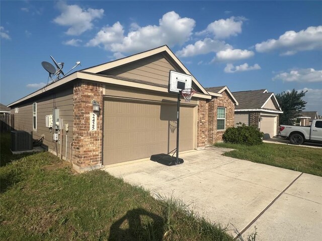 2425 Arctic Warbler, New Braunfels, TX 78130 - view of side of property featuring a garage, driveway, and brick siding