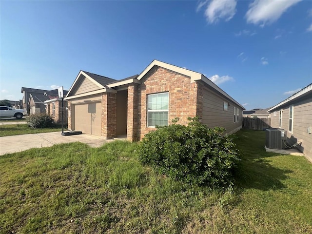2425 Arctic Warbler, New Braunfels, TX 78130 - view of home's exterior featuring brick siding, driveway, and an attached garage