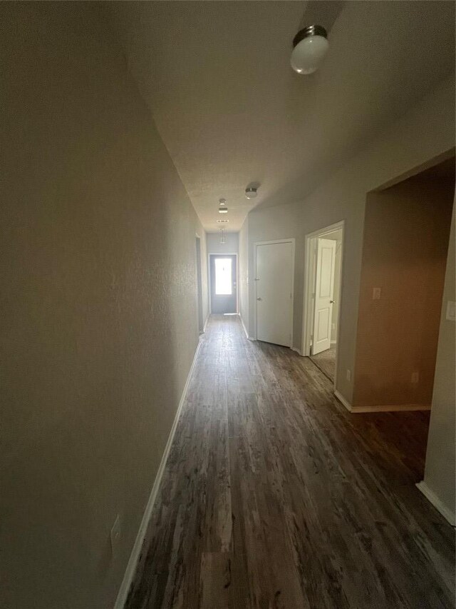 2425 Arctic Warbler, New Braunfels, TX 78130 - hallway featuring dark wood-type flooring and baseboards