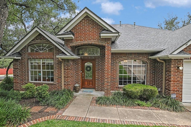 5801 Taylor Draper Cv, Austin, TX 78759 - view of front of home with brick siding and roof with shingles
