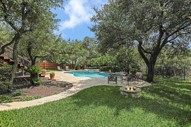 5801 Taylor Draper Cv, Austin, TX 78759 - view of swimming pool featuring a fire pit, a fenced backyard, a patio, view of wooded area, and a pool with connected hot tub