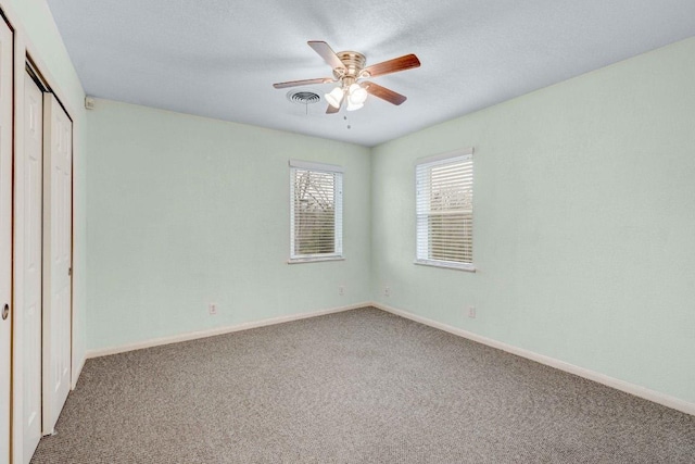 7105 Creighton Ln, Austin, TX 78723 - unfurnished bedroom featuring carpet, a closet, and ceiling fan