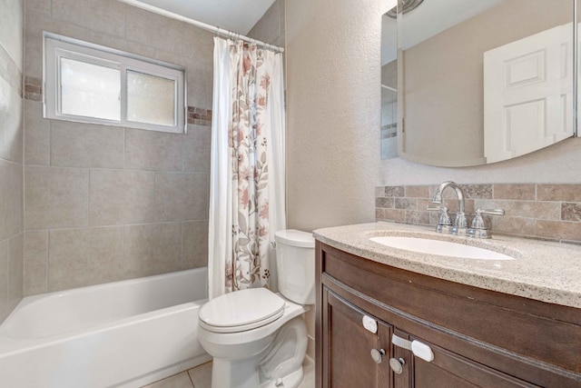 7105 Creighton Ln, Austin, TX 78723 - full bath featuring vanity, toilet, shower / bath combo, backsplash, and tile patterned flooring