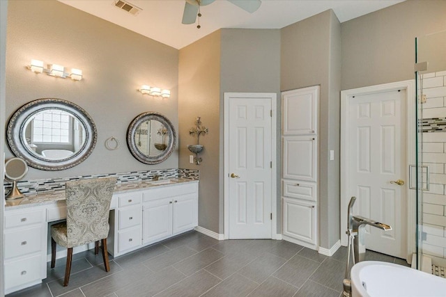 12505 Stapp Ct, Austin, TX 78732 - full bathroom with a ceiling fan, vanity, decorative backsplash, baseboards, and a tub