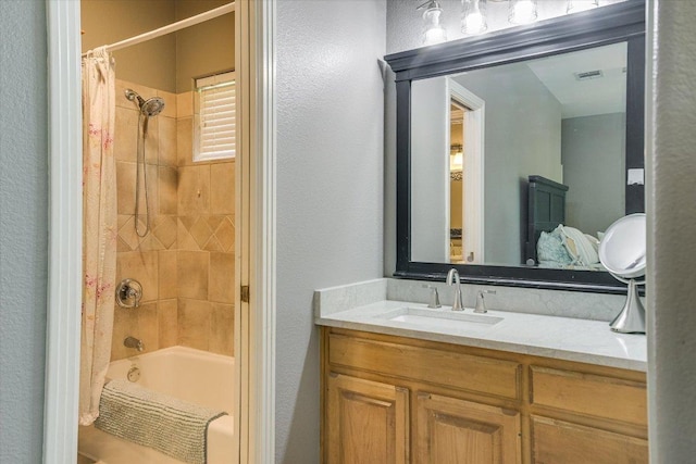 12505 Stapp Ct, Austin, TX 78732 - bathroom featuring shower / bath combo with shower curtain, vanity, and a textured wall