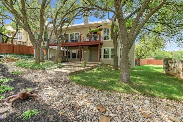 12505 Stapp Ct, Austin, TX 78732 - rear view of property featuring stucco siding and a patio