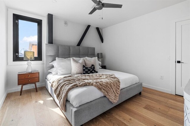 1800 E 4th St Unit 396, Austin, TX 78702 - bedroom featuring light wood-style flooring, baseboards, and ceiling fan