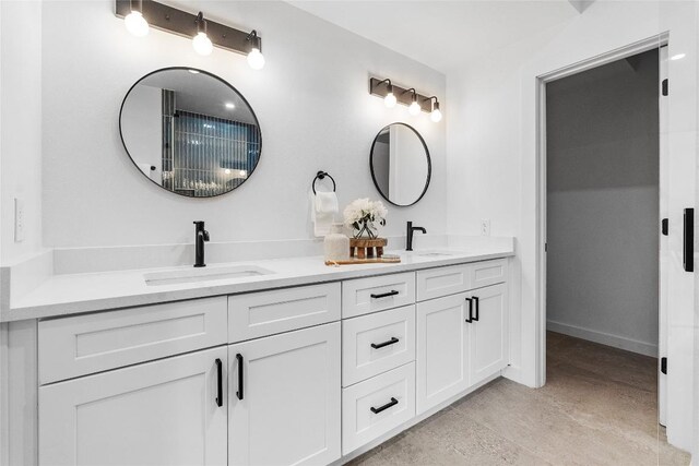 1800 E 4th St Unit 396, Austin, TX 78702 - full bathroom featuring double vanity and baseboards
