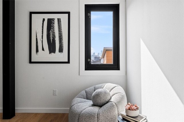 1800 E 4th St Unit 396, Austin, TX 78702 - sitting room featuring baseboards and wood finished floors