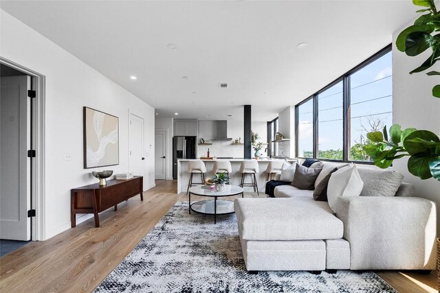 1800 E 4th St Unit 396, Austin, TX 78702 - living room with light wood-style floors and recessed lighting