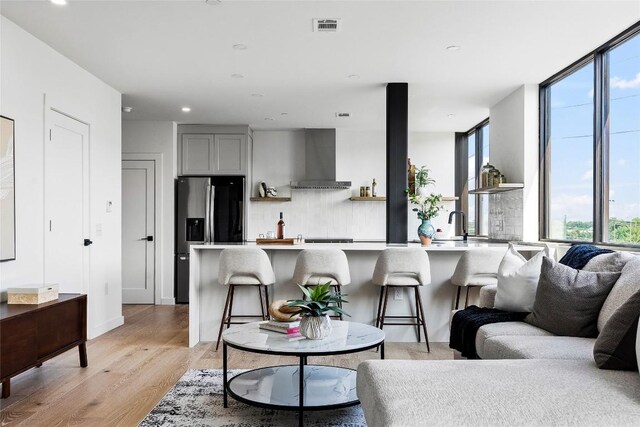 1800 E 4th St Unit 396, Austin, TX 78702 - living room featuring light wood-style floors and recessed lighting
