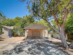 404 W Dittmar Rd, Austin, TX 78745 - view of front of house featuring driveway and a carport