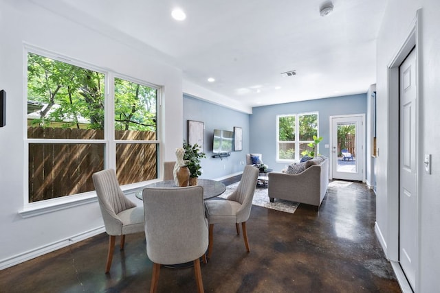 3407 Banton Rd Unit A, Austin, TX 78722 - dining space with concrete flooring, plenty of natural light, recessed lighting, and baseboards
