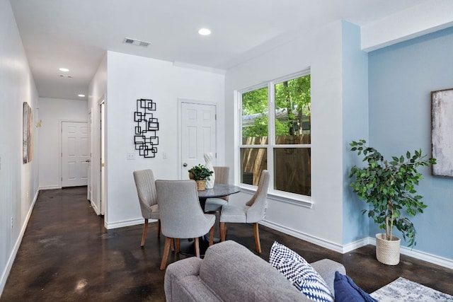3407 Banton Rd Unit A, Austin, TX 78722 - dining space featuring concrete flooring, baseboards, and recessed lighting