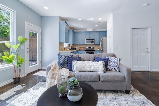 3407 Banton Rd Unit A, Austin, TX 78722 - living room featuring baseboards, finished concrete flooring, and recessed lighting